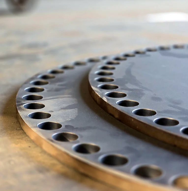 Laser-cut mild steel pump flange with bolt circle holes